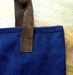 You are getting a unique handbag, since no two bags are alike. A great handbag to use like going-out bag, work bag, casual bag and more.  In this handbag we use a  Japanese Shibori technique, then dyed in natural indigo to make this pattern. All the process is handmade.  This handbag is made of 100% cotton denim, dyed in natural indigo obtained from Añil plant. With brown leather handles, a dark blue cotton lining and an always very useful inner pocket. Approx., measurements:Height:  14 1/2 inWi Blue Cotton Bags With Leather Handles, Waxed Canvas Tote Shoulder Bag With Handles, Blue Waxed Canvas Bag For Daily Use, Blue Rectangular Waxed Canvas Bag, Daily Use Blue Waxed Canvas Bag, Rectangular Blue Waxed Canvas Bag, Blue Canvas Bag With Leather Handles For Shopping, Blue Canvas Bag With Leather Double Handles, Blue Canvas Bag With Double Leather Handles