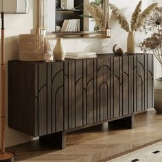 a wooden cabinet sitting in front of a mirror on top of a hard wood floor