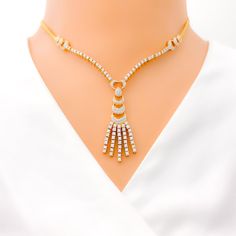 This exquisite 18k gold set, weighing a total of 27.8 grams, features a unique heart-accented chandelier design adorned with dazzling diamonds. The yellow gold finish enhances its luxurious appeal, making it perfect for any special occasion. The set includes a necklace with a total diamond weight of 3.75 carats, featuring F-G color and VS quality diamonds in round brilliant cut shapes. The necklace has a length of 15.75 inches with a 2-inch drop length, adjustable 1.8-inch links, and a secure ho Elegant Yellow Gold Necklaces For Celebrations, Elegant Yellow Gold Diamond Necklace For Evening, Elegant Yellow Gold Necklace For Celebration, Gold Brilliant Cut Diamond Necklace For Party, Gold Brilliant Cut Diamond Necklace For Evening, Luxury Hand Set Diamond Necklace For Party, Luxury Hand-set Diamond Necklace For Party, Modern Diamond Wedding Necklace, Modern Gold Diamond Necklace For Anniversary