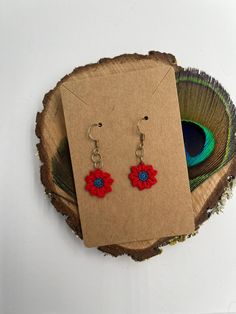 Add a touch of elegance and charm to your outfit with these beautiful red crochet flower earrings. Handmade with care and passion, each pair is unique and perfect for any occasion, whether it's a special event or a casual outing. Product Details: Material: High quality cotton thread Color: Bright red Hook: Silver, hypoallergenic and nickel-free for sensitive skin Weight: Light and comfortable to wear all day Features : Handmade: Each flower is hand crocheted with special attention to detail. Uni Crochet Flower Earrings, Red Crochet, Red Hook, Flower Crochet, Crochet Flower, Red Flower, Cotton Thread, Flower Earrings, Hand Crochet