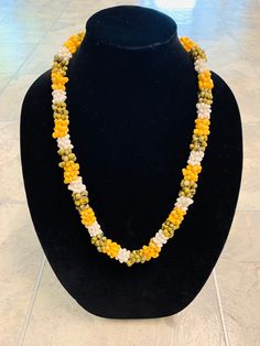 Hawaii Multi-Colored Mongo Shell Lei Necklace. This lei measures 28 inches in length when untied. Yellow, white, and green mongo shells comprise this lei. The lei is finished off with two genuine kukui nuts. This is a great gift for someone special! Graduation Money Lei, Kukui Nut, Money Lei, Hawaiian Jewelry, 50th Wedding Anniversary, Silver Foil, Up Girl, Chain Styles, Lei Necklace