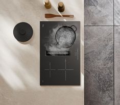 an overhead view of a cookbook and utensils on a table