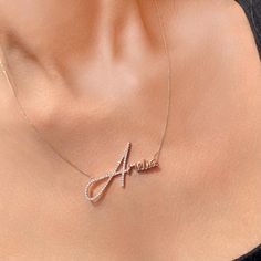 Our Signature Style Name Necklace with Diamond is absolutely stunning thanks to lots of lovely touches that combine to create a one-of-a-kind pendant that celebrates life, family, or love. A layering essential, it showcases elegant script font, a slim chain, and an initial with artificial diamond. Handcrafted of Sterling Silver, this necklace features: 1 personalized name Delicate handwriting script font Matching chain Description: Material: 14k White Gold Plated Sterling Silver 0.925/14k yellow Elegant Pendant Chain Necklace With Name, Elegant Diamond Name Necklace For Gift, Elegant Name Chain Necklace For Gift, Elegant Diamond Name Necklace Gift, Diamond Name Necklace As Gift, Font Matching, Diamond Name Necklace, First Letter Of Your Name, Handwriting Script