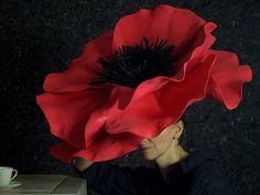 A POPPY FLOWER as a headdress will be useful to every lover of original creations, cosplays, disguises and as a theatrical prop as well. Intense red will attract attention and impress the audience. The advantage of the product is careful, hand-made eva foam. The flower is attached to a band to keep it in place and easy to use. The poppy flower is a romantic and mysterious symbol that will liven up any party. ♥ MATERIALS: Eva foam ♥ COLOURS: Red ♥ SIZE: Universal ♥ Flover DIMENSIONS: diameter ~ 2 Poppy Flower Costume, Elegant Adjustable Flower Costume Hat, Red Adjustable Novelty Costume Hats And Headpieces, Poppy Installation, Oversized Flower Headpiece, Costume Fleur, Elegant Flower-shaped Adjustable Costume Hat, Wizard Of Oz Play, Theatre Props