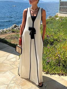 White Sleeveless Maxi Dress For Beach Season, Sleeveless Lined Maxi Dress For Beach Season, Elegant Summer Dress With Vest, Elegant Summer Vest Dress, Elegant Summer Dress With Vest Detail, White Vest Dress For Summer, Chic Sleeveless White Maxi Dress, Chic Sleeveless Dress For Spring, Chic Sleeveless Vest Dress For Spring