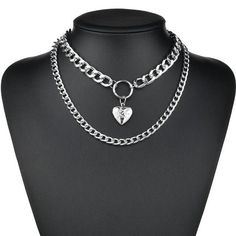 "Unleash your inner romantic with our Large Silver Heart & Chain Layered Necklace Set. Featuring a stunning large silver heart pendant and two Cuban style chain layers, this set is perfect for adding a touch of edge to any outfit. Make a statement with this unique and versatile accessory. Good to Know: Can be worn at a variety of lengths Charm Size: 30mm long x 16mm wide Silver Plated Unisex Sizing Short necklace - 16\" Long necklace - 20\"" Simple Chain Necklace, Goth Necklace, Heart Choker Necklace, Simple Chain, Lock Necklace, Goth Jewelry, Layered Necklace Set, Heart Choker, Long Necklaces