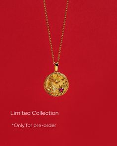 Discover the majestic allure of the Fiery Dragon Coin Pendant, a piece rich in symbolism and splendor. This ornate coin necklace showcases a meticulously carved dragon, an emblem of strength and good fortune, set against a backdrop of gleaming gold. At the heart of the design lies a vibrant ruby, a gemstone celebrated for its passion and vitality. Perfectly suspended on a classic chain, this pendant is a fusion of tradition and luxury, making it an ideal piece for those who seek to carry the power of the dragon and the fire of the ruby close to their heart. Gold Dragon Design Jewelry, Gold Jewelry With Dragon Design, Gold Round Jewelry With Dragon Design, Round Dragon Design Necklace For Gift, Dragon Design Amulet Necklace, Yellow Gold Dragon Design Jewelry Gift, Symbolic Dragon Design Round Pendant Necklace, Yellow Gold Jewelry With Dragon Design For Gift, Gold Dragon Design Round Pendant Jewelry