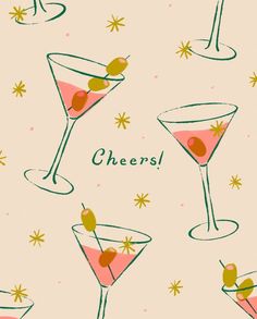 two martini glasses with olives on them and the words cheers written in green ink