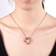 Accentuate your neckline with the glittering romance of this overlapping heart pendant necklace, embellished with sparkling crystals beset in a warm 18k rose gold-plated. Chain : 17.7" L with 2" extender Pendant : 1.02" W x 0.98" L Lobster claw clasp 18k rose gold-plated copper / cubic zirconia 8.2 g Rose Gold Heart Necklace With Cubic Zirconia, Rose Gold Cubic Zirconia Heart Necklace, Rose Gold Pendant Heart Necklace, Pendant Cubic Zirconia Rose Gold Necklace, Rose Gold Double Heart Jewelry For Party, Mother's Day Rose Gold Heart Necklace With Cubic Zirconia, Valentine's Day Rose Gold Clavicle Chain Necklace, Valentine's Day Rose Gold Heart Clavicle Necklace, Rose Gold Heart Pendant Necklace With Clavicle Chain