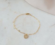 These initial bracelet are a timeless, classic and elegant gift that will always be in style. The perfect birthday gift, for Mom, Grandma or anyone special in your life.  If you're looking to get something special for someone who likes to keep it classy, this bracelet makes a great choice.   ⭐︎ Details:      ♡ 14k Gold Filled Chain High Quality (Tarnish Resistant)      ♡ 100% hypoallergenic, lead and nickel free.     ♡ Waterproof Quality    C A R E ∙ T I P S To maintain the Perfect Quality of your new Velvet Collection Necklace, please: * Wash your bracelet with neutral soap once a week. Don't forget to dry it perfectly! * Gently polish with a soft, lint-free cloth.  * Avoid direct contact with perfumes, body oils, and other chemicals, including household cleaners.  * Store your beloved je Classic Name Bracelet For Mother's Day Gift, Gold Charm Bracelet Gift, Classic Initials Bracelet, Perfect As Gift, Classic Hypoallergenic Bracelets As Personalized Gift, Classic Hypoallergenic Bracelets For Personalized Gifts, Classic Engraved Charm Bracelet Gift, Classic Name Chain Bracelet For Gift, Classic Name Chain Bracelet As Gift, Dainty Jubilee Charm Bracelet For Anniversary