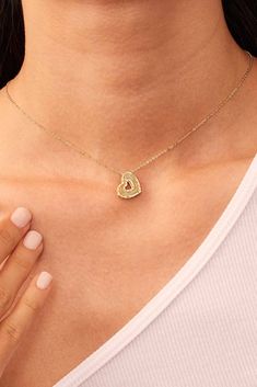 Crafted in Italy from exquisite 14k gold, our Icon Heart Pendant Necklace offers a dazzling play of light that captures attention with every movement. Delicate cut-out hearts line the rim for a little romance, while a handcrafted design adorns the surface for some sophistication. Metal: 14k Yellow Gold Charm Dimensions: 15mm Tall, 15mm Wide Chain Dimensions: 1.2mm Thick, 18 Inches Long, Adjustable to 16 or 17 Inches Construction: Lobster Clasp, Rolo Chain Weight: 2.1 Grams Origin: Crafted in Are Yellow Gold Diamond Open Heart Jewelry, Yellow Gold Open Heart Diamond Jewelry, Gold Heart Pendant Jewelry With Diamond Accents, Gold Heart Jewelry With Diamond Accents, Yellow Gold Jewelry Stamped 14k With Double Heart, Fine Jewelry Yellow Gold Heart Cut Necklace, 14k Stamped Yellow Gold Double Heart Jewelry, Stamped 14k Yellow Gold Double Heart Jewelry, Fine Yellow Gold Heart Necklace