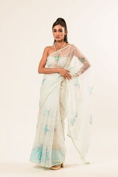 Explore the elegance of our White Organza Saree with floral embroidery. Perfect for any event, it combines comfort with style, ensuring you look and feel regal. Summer Reception Saree With Dupatta, Traditional Tissue Silk Sets For Spring, Cotton Silk Wedding Dress For Summer, Organza Blouse Piece With Floral Embroidery For Reception, Summer Saree With Zari Work For Reception, Summer Reception Saree With Zari Work, Summer Wedding Dress In Cotton Silk, Organza Saree With Floral Embroidery For Reception, Reception Organza Saree With Floral Embroidery