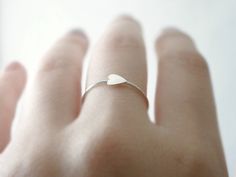 Silver heart ring - delicate dainty jewelry A small heart charm is soldered sideways on a handmade ring band for this simple and sweet, everyday band. Wear it stacked or for a minimal look wear alone. measurements Heart charm - approx. 5x4mm Ring band - full and half sizes only *Matching earrings here! http://etsy.me/TWhSow **Can also be made with heart centered (not sideways) // just leave me a note in message to seller you would prefer heart centered ** (sample image coming soon) ♦you can ente Silver Heart Ring, Winter Chic, Delicate Rings, Small Heart, Ring Band, Dainty Jewelry, Silver Heart, Matching Earrings, Heart Charm