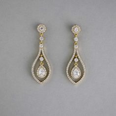 Glistening teardrop-shaped CZ earrings, crafted in layers of timeless beauty, will add a touch of subtle elegance to your bridal look. These earrings are rhodium or gold plated, hypoallergenic, lead, nickel, and cadmium free, and made with AAA CZ stones. They measure about 2 inches long and 5/8 inches wide and have post pierced backs. Wedding Day Earrings Brides, Bride Hair Down, Teardrop Bridal Earrings, Fav Products, Teardrop Jewelry, Weaving Ideas, Gold Earrings Wedding, Wedding Day Jewelry, Pinterest Ideas