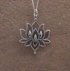 "Beautiful sterling silver lotus flower mandala pendant necklace.  The pendant measures 2.6cm in height (not including the bale) and 2.4cm in width.  Looks beautiful as a choker on the 16\" chain.  The necklace hangs from a sterling silver curb chain (please choose desired length from the drop-down menu. Lovely gift idea. Wrapped in tissue paper and presented in an organza pouch. Please note the bail may differ to the one pictured." Silver Lotus Flower Necklace, Bohemian Sterling Silver Jewelry With Flower Charm, Bohemian Sterling Silver Flower Necklace, Spiritual Oxidized Flower Pendant Jewelry, Dainty Flower Pendant Jewelry For Meditation, Delicate Silver Necklace For Meditation, Oxidized Pendant For Meditation, Oxidized Finish Pendant For Meditation, Spiritual Sterling Silver Flower Shaped Jewelry