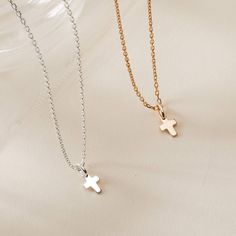 A timeless classic to treasure each day, our Mini Cross Charm Necklace is perfect for commemorating those special moments. Gift to a loved one or cherish your new favorite necklace in either 18K Champagne Gold Plated or 925 Sterling Silver.&nbsp;18K Champagne Gold Plated or 925 Sterling SilverMini Cross: 0.3 x 0.2Charms are removable from this chain and can be worn on all Merci Maman chain lengthsSent with love in a complimentary gift box Minimalist 14k Gold Cross Pendant Necklace, Classic Clavicle Chain Necklace With Cross Pendant, Classic Cross Pendant Clavicle Necklace, Classic Cross Clavicle Chain Necklace, Elegant Gold Cross Necklace With Round Pendant, Cross Pendant Jewelry Gift For Her, Classic Rose Gold Plated Charm Necklaces, Minimalist Cross Necklace Tarnish Resistant, Elegant Cross Pendant Necklace As Gift