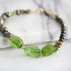 Raw Peridot Bracelet  August Birthstone Jewellery  Raw Stone Green Stone Bracelets As A Gift, Green Beaded Stone Bracelets As Gift, Green Beaded Bracelets With Stones As Gift, Modern Green Gemstone Bracelets, Modern Green Peridot Jewelry, Unique Green Bracelet With Gemstone Beads, Unique Green Gemstone Bracelets, Green Beaded Bracelets For Jewelry Making, Adjustable Peridot Bracelet