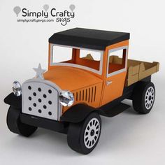 an orange and black toy truck on a white background with the words simply crafty next to it