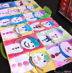 a table covered in paper with snowmen on it