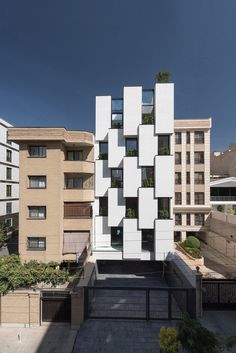 an apartment building with many windows and balconies