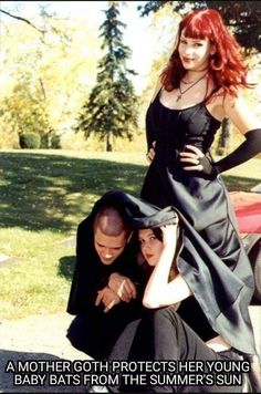 two women and a man posing in front of a car with the caption'a mother goth protects her young baby bats from the summer's sun