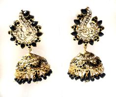 "BLACK GOLD JHUMKA EARRINGS If traditional Jhumka Earrings is what you love then enjoy this new beauty that I just designed in my New Collection for 2013. These earrings are 4 inches long from top to tip Made with a Gold plated Base the posts is hypoallergenic.These are light to medium weight. The design is inspired from the ROYAL BIRD OF INDIA \" The Peacock\". The jhumki has Gold polish and is embellished with black stones and crystals . A favorite in the fashion circuits. Enjoy this piece to Luxury Festive Chandbalis With Peacock Design, Elegant Black Danglers For Festive Season, Elegant Black Danglers For Festive Occasions, Black Temple Jewelry Earrings For Wedding, Black Earrings For Wedding And Festive Occasions, Elegant Black Earrings For Festive Occasions, Festive Elegant Black Earrings, Elegant Festive Black Earrings, Elegant Black Festive Earrings