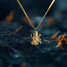 Elevate your style with our Ganesh pendant. This solid gold Ganesh necklace captures the essence of the Elephant. PENDANT INFORMATIONThis pendant is made of real, solid gold.• Made in USA• Material: 14k or 18k solid gold• Finish: polished• Height: 1.25" (32 mm) x Width: 0.9" (22,5 mm)• Pendant weight: approx. 6 grams (14k)• Bail: fits up to 4 mm chains• Solid back, not hollow• A certificate of authenticity is included• Delivered in our elegant jewelry box, making it the perfect gift Shipping: Al Traditional Tarnish Resistant Pendant Jewelry, Yellow Gold Jewelry For Festivals, Traditional Pendant Necklace Tarnish Resistant, Yellow Gold Temple Jewelry Necklaces For Puja, Yellow Gold Round Pendant Temple Necklace As Gift, Yellow Gold Temple Necklace With Round Pendant, Symbolic Hallmarked Jewelry For Festivals, 22k Gold Temple Necklace Pendant As Gift, Gold Temple Necklace In Sterling Silver As A Gift