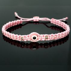 Hand-Made Pink String Bracelet With An Evil Eye For Wrist Sizes From 6 To 9 In. These Bracelets Are Worn To Attract Good Fortune, Bring A Good Mood And To Ward Off Bad Vibes. Evil Eye Bracelet Braided, Pink Adjustable Bracelet Jewelry, Elegant Adjustable Pink Friendship Bracelets, Pink Resizable Braided Bracelet, Adjustable Pink Evil Eye Bracelet, Elegant Pink Braided Bracelets As Gift, Elegant Pink Braided Bracelet Gift, Alpha Knot, Evil Eye Meaning