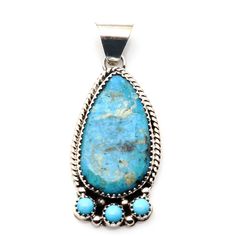 Be captivated by the beauty and craftsmanship of this turquoise pendant by Navaho artist Roy Yazzie (Hallmark RY). Adorned with a single stunning setting and 3 turquoise cabs at the bottom, this 1 3/4" long pendant (weighing 7.8 grams) is the perfect addition to any 6mm chain or necklace. Let this piece inspire your sense of style and showcase your appreciation for unique, handcrafted jewelry. Unique Handcrafted Jewelry, Long Pendant, Turquoise Pendant, Tear Drop, Handcrafted Jewelry, The Beauty, Hallmark, Sense, Turquoise