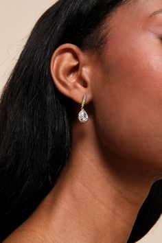 Add an expensive vibe to any date-night look with the Lulus Posh Drama Gold Rhinestone Teardrop Earrings! Shiny gold-toned metal shapes these stunning earrings that have a teardrop-shaped silhouette with a halo of clear rhinestones along the posts surrounding the rhinestone focals. Post Backs. 1" Long. 70% Brass, 30% Cubic Zirconia. Imported. Lulus | Posh Drama Gold Rhinestone Teardrop Earrings. Elegant Metal Dangle Drop Earrings, Glamorous Drop Teardrop Earrings For Pierced Ears, Glamorous Teardrop Drop Earrings For Pierced Ears, Chic Teardrop Earrings For Formal Occasions, Elegant Metal Drop Earrings, Elegant Teardrop Pendant Earrings For Pierced Ears, Single Teardrop Earring For Party, Elegant Teardrop Pendant Earrings, Glamorous Cubic Zirconia Teardrop Crystal Earrings