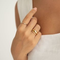 A statement ring with a puffy tapered design, crafted in gold vermeil. 

Band width: 2mm - 6.4mm
 Size: 5, 6, 7, 8, 9 Elegant Stackable Yellow Gold Wide Band Ring, Elegant Yellow Gold Stackable Wide Band Ring, Elegant Stackable Wide Band Ring In Yellow Gold, Elegant Yellow Gold Stackable Rings With Thick Band, Timeless 14k Gold Wide Band Ring, Chic Polished Finish Formal Ring, Timeless Gold Bands With Ring Detail, Elegant Gold Bands With Tarnish Resistance, Elegant Gold Bands Tarnish Resistant