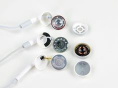 an assortment of electronic gadgets on a white surface