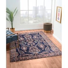 This area rug features eye-catching floral designs and a patterned border, adding a vibrant look to your indoor space. It's power-loomed from polyester, resulting in a flat woven texture that's soft underfoot. We love how the salmon pink, white, and navy blue color palette has plenty of weathering for a lived-in, boho vibe. Plus, it has a medium 0.4" pile height that's ideal for low-traffic rooms like your home office or bedroom. While it doesn't have a non-slip backing, we recommend using a rug Pond Walkway, Blue Pink Rug, Dark Grey Rug, Blue Colour Palette, Pink Area Rug, Woven Texture, Purple Rug, Ivory Rug, Salmon Pink