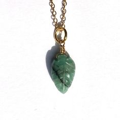 Emerald Leaf Pendant A stunning Emerald carved Leaf Pendant on a 24k Gold Plated Sterling Silver Chain.  This Pendant is handmade with 24k Gold Plated Sterling Silver wire on a gold plated sterling silver chain.  Emerald - Love, Intuition and Abundance  It's a beautiful piece of Jewellery, that's great as for everyday wear - a great gift.  Please see the other Leaf Pendant Necklaces we have in our store.  The necklace comes in its own Organza bag, Sweet Matchbox style box. Ready to give as a gif Gold Jade Necklace Gift, Dainty Gold Jade Necklace, Handmade Yellow Gold Jade Necklaces, Handmade Yellow Gold Jade Necklace, Gold Emerald Necklace As Gift, Gold Emerald Necklace In 14k As A Gift, Gold Emerald Necklace In 14k Gold As Gift, 14k Gold Emerald Necklace For A Gift, Dainty Gold Plated Emerald Necklace As A Gift