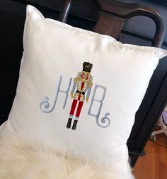 a white pillow with a nutcracker on it