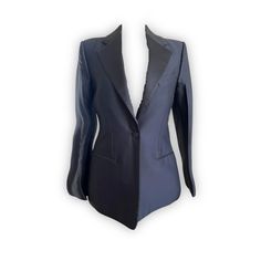 Revamp your wardrobe with this timeless black CELINE BY PHOEBE PHILO TUXEDO blazer, featuring striking satin lapels and pockets. Make a bold fashion statement in this designer item, crafted from luxury materials. Dare to be different in this exquisite FR 36 blazer. Wow your friends and colleagues with this sleek and stylish look - perfect for any occasion! If you have an inquiry or specific questions for this archive piece: Please send us a chat on our website or send an email to info@theremoda. Designer Black Blazer With Pressed Crease, Black Long Sleeve Blazer With Structured Boning, Black Blazer With Structured Boning And Long Sleeves, Long Sleeve Silk Suit For Office, Designer Silk Blazer With Hidden Button Closure, Designer Black Blazer With Notch Lapel, Designer Black Blazer With Hidden Buttons, Designer Silk Blazer For Office, Tailored Black Evening Blazer