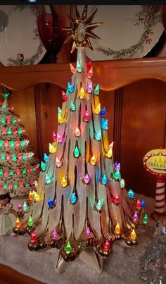 a christmas tree made out of plastic and colored lights