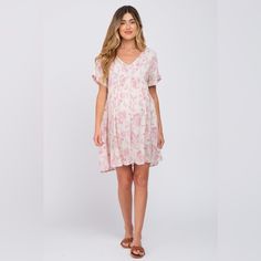 A Floral Print Maternity Dress Featuring A V-Neckline, Short Dolman Sleeves, And An Empire Waist. First Love By Pinkblush New Without Tags Inventory #P6931 Pink Floral Print V-neck Mini Dress, Pink Floral Print V-neck Dress For Summer, Flowy Floral Print V-neck Dress For Day Out, Summer Floral Print V-neck Dress For Daywear, Feminine Floral V-neck Dress For Day Out, Feminine V-neck Dress For Daywear, Pink Feminine V-neck Dress For Vacation, Feminine Pink V-neck Dress For Vacation, Feminine V-neck Mini Dress For Daywear