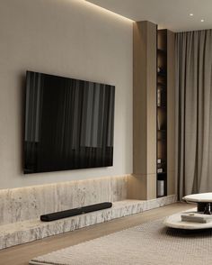 a large flat screen tv mounted to the side of a wall in a living room