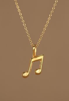 Gold music note necklace - music note - eighth note necklace - a 22k gold plated eighth note on a 14k gold vermeil chain This perfectly cute and tiny 22k gold plated bronze eighth note hangs happily from a 16 inch 14k gold vermeil chain. Please feel free to select a different length chain if you prefer! Need an energy boost? You can also add a little tourmaline drop if you like! https://www.etsy.com/listing/156969259/tourmaline-drop-energy-boost-add-a?ref=shop_home_active Looking for other charm Music Inspired Jewelry, Music Themed Jewelry, Necklace Music, Music Note Necklace, Nota Musical, Eighth Note, Pretty Jewelry Necklaces, Musical Jewelry, Music Jewelry