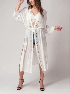 Add a touch of boho chic to your wardrobe with this kimono style cardigan. The front lace detail adds a touch of femininity and the long, flowy fit is perfect for a day at the beach or pool. This versatile piece can be worn as a cover up for your swimsuit, or as a festive addition to your outfit for a spring or summer party. Take it on your next resort vacation for a touch of bohemian flair. This kimono cardigan is the ultimate beach boho accessory Small (2/4), Medium (6/8), Large (10) Maxi Card Chic Lace Cover-up For Beach Season, Spring Festival Lace Cover-up, Bohemian Lace Patchwork Summer Cover-up, Spring Beach Party Cover-up With Crochet Trim, Bohemian Spring Brunch Cover-up, Chic Lace Trim Beach Cover-up, Bohemian Long Sleeve Beach Cover-up, Lace Open Front Cover-up For Summer, Flowy V-neck Cardigan For The Beach