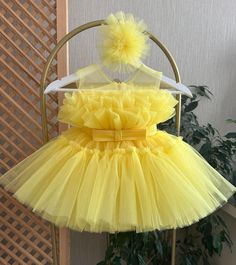 Yellow Toddler Tulle Dress, Pageant Baby Dress, First Birthday Dress With Claps, Baby Tutu Dress, Girl Party Dress, Princess Dress This baby girl dress is specially designed and handmade for your baby girl. Your girl will be like a princess with these dresses that she can wear on special occasions such as birthdays, weddings and christmas. This dress, which will create your girl's style with a clasp and shoes, is ideal for special occasions. Check out our baby girl dresses selection for unique handmade dresses from AymiraDesign. ✿ Product Features; ✰ Baby Dress Materials: Tulle ✰ Baby Dress Color: Yellow ✰ Set Content: Dress, Clasp ✰ Size Options: * 0-3 months, 3-6 months, 6-9 months, 9-12 months, 12-18 months, 18-24 months, 2T, 3T, 4T, 5, 6 US kids' numeric More from Baby Girl Dress Colle Elegant First Birthday Summer Tutu Dress, Yellow Tulle Dress For Birthday, Yellow Ruffled Tutu Dress For Wedding, Yellow Baptism Dress For Summer, Yellow Princess Dress With Ruffles For Party, Yellow Summer Dress For Baptism, Yellow Wedding Tutu Dress With Ruffles, Summer Princess Dress With Ruffles For First Birthday, Cute Yellow Tutu Dress For Party