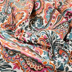 an orange, blue and pink paisley print fabric