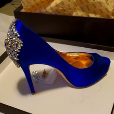 The Dramatic Jeweled Details On The Heel Of The Kiara Evening Pumps Are Sure To Turn Some Heads. By Badgley Michka. Satin Upper Round Peep-Toe Platform Evening Pumps With Embellished Detail 1/2" Platform, 4-1/2" Heel Worn Once For A Wedding. Comes With Replacement Jewels And Heel Taps Blue Rhinestone Wedding Shoes For Formal Occasions, Blue Wedding Shoes With Rhinestones, Blue Rhinestone Wedding Shoes, Blue Embellished Shoes For Formal Occasions, Blue Embellished Wedding Shoes For Formal Occasions, Blue Glamorous Wedding Shoes For Party, Blue Embellished Wedding Shoes, Glamorous Blue Heels For Weddings, Blue Embellished Evening Wedding Shoes