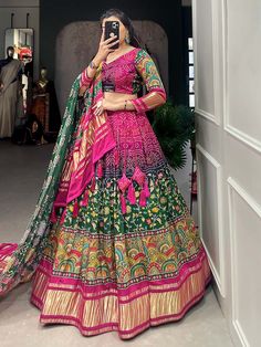 This exquisite multi-color gaji silk lehenga is adorned with intricate digital print and lagadi patta work. Paired with a matching gaji silk choli featuring identical digital print and lagadi patta work, and complemented by a stunning green gaji silk dupatta adorned with digital print and lagdipatta work, complete with tassels on both sides, this ensemble exudes elegance and charm.
The multi-color palette of the lehenga, combined with the beautiful digital print and lagadi patta work, creates a Silk Sharara With Digital Print For Navratri, Silk Digital Print Sharara For Navratri, Silk Digital Print Choli For Navratri, Silk Choli With Digital Print For Navratri, Navratri Silk Choli With Digital Print, Festive Silk Choli With Digital Print, Multicolor Digital Print Lehenga For Wedding, Traditional Drape Choli With Digital Print For Wedding, Wedding Choli With Traditional Drape And Digital Print