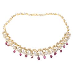 This 18K yellow gold necklace presents a dynamic design with and opulent frosting of round faceted diamonds. Suspended from the necklace are a fringe of pink tourmaline beads, adding a colorful touch to the piece. Diamonds are approximately 8.0 TCW. Hook style clasp Marks: Unmarked, Tested as 18K Dimensions: 16" L x 1" W Weight: 45.1 Gross dwt Vintage Choker Necklace, Vintage Choker, Yellow Gold Necklace, Fringe Necklace, Tourmaline Beads, Dynamic Design, Lorde, Pink Tourmaline, Vintage Necklace