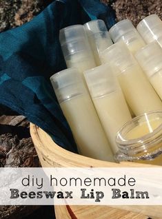 a basket full of beeswax lip bales with the words diy homemade beeswax lip balm