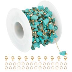 a spool of turquoise beads and gold chains