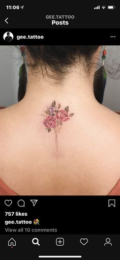 the back of a woman's neck with pink flowers on her left side and an arrow