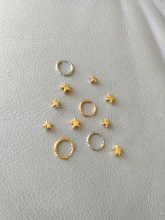 18K gold plated stainless steel, stainless steel. Star charm measures 9 mm x 9 mm. More earrings  https://www.etsy.com/shop/CornerByZ?ref=seller-platform-mcnav If you have any questions, please feel free to contact me. Everyday Jewelry With Star Charm, Gold Huggie Nose Rings Nickel Free, Small Gold Sterling Silver Huggie Earrings, Dainty Gold Huggie Piercings, Nickel Free Gold Huggie Nose Rings, Nickel Free Gold Huggie Piercings, Gold Huggie Piercings Nickel Free, Gold Septum Ring Tarnish Resistant As A Gift, Dainty Gold Septum Ring For Everyday